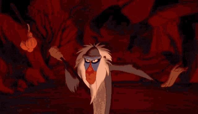a baboon and a meerkat from the lion king are standing next to each other in a cave .