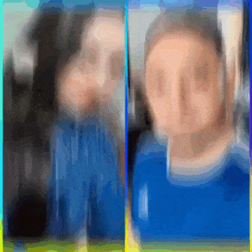 a blurry picture of a woman and a boy in blue shirts