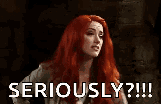 a woman with red hair is making a funny face and saying `` seriously ? !! ''