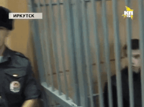 a man in a jail cell with the word irkutsk on the bottom left