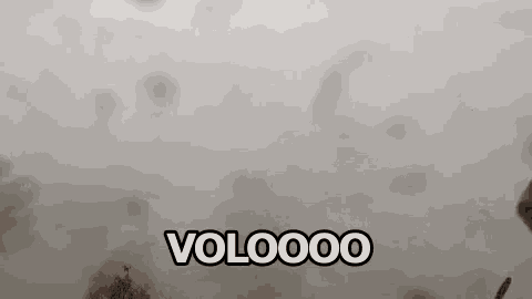 a gray background with a few clouds in it and the words volooo written in white letters .