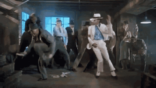 a man in a white hat is dancing with a group of people