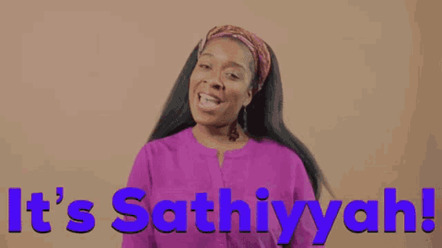 a woman in a purple shirt says it 's sathiyyah while waving her hand .