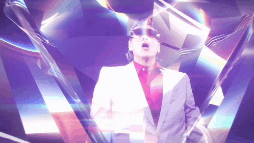 a man in a suit and sunglasses is surrounded by a purple and blue background