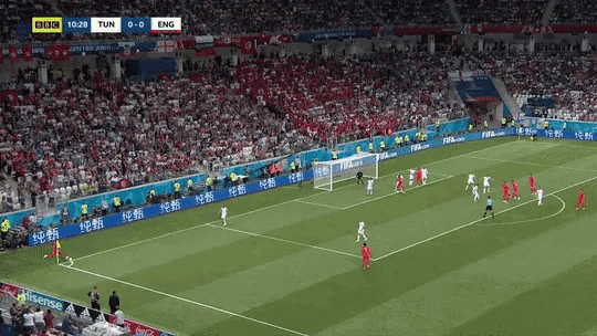 a soccer game is being played in front of a large crowd and the score is 0-0