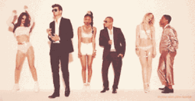 a group of people standing next to each other in a line