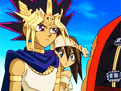 two anime characters are standing next to each other