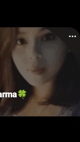 a close up of a woman 's face with the word arma in the background