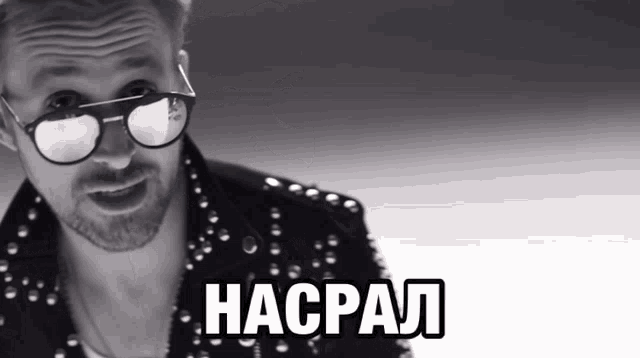 a black and white photo of a man wearing sunglasses and a jacket with the word hacpal on it