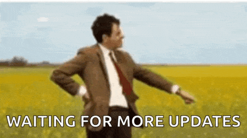 a man in a suit and tie is dancing in a field with the words `` waiting for more updates '' behind him .