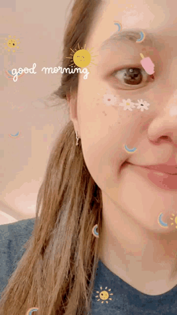 a woman with stickers on her face and the words good morning