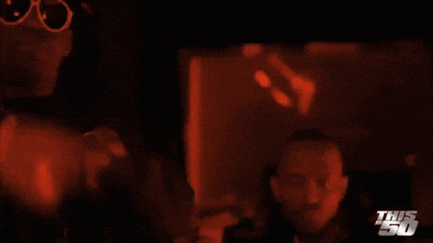 a blurred image of a person with the words this 50 on the bottom right