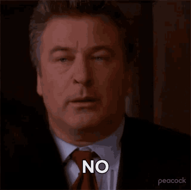 a man in a suit and tie is saying `` no '' .