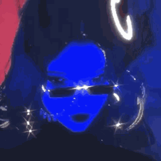 a girl with a blue face and sunglasses is wearing a wig and earrings .