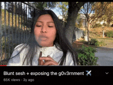 a woman smoking a cigar with the caption blunt sesh + exposing the gov3rnment 65k views 3y ago