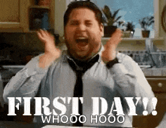 a man in a tie is celebrating his first day at work .