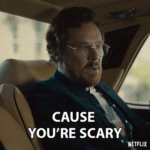a man sitting in a car with the words cause you 're scary on the screen