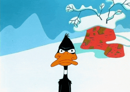 a cartoon of a duck standing in the snow with mountains in the background