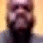 a blurry picture of a man with a beard