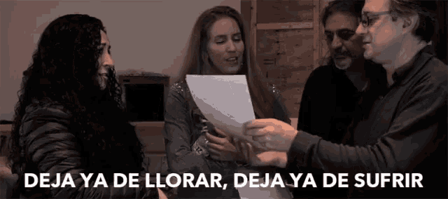a woman holding a piece of paper with deja ya de llorar deja ya de sufrir
