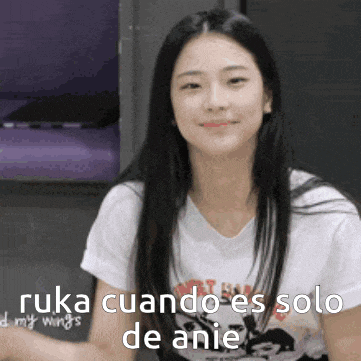 a woman in a white shirt is smiling with the words ruka cuando es solo de anie written below her