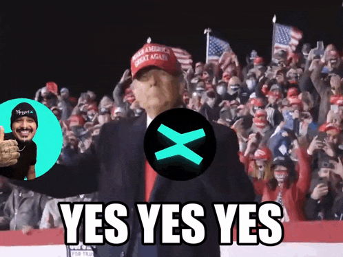 a man wearing a maga hat stands in front of a crowd and says " yes yes yes "