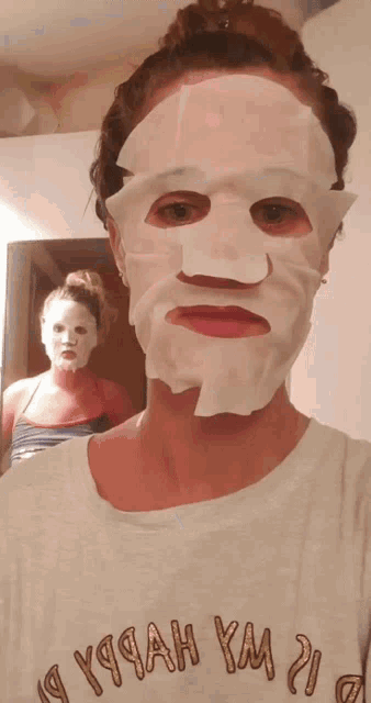 a woman wearing a face mask is wearing a shirt that says " y99ah ym "