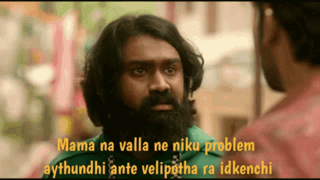 a man with a beard is talking to another man with the words mama na valla ne niku problem aythudhi ante velipotha ra