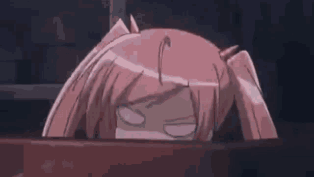a pink haired anime girl is making a funny face while sitting in a bathtub .