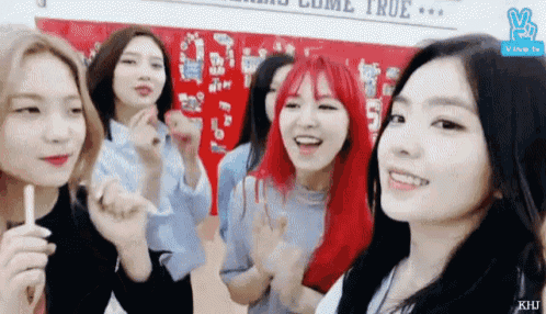 a group of young women with red hair are standing next to each other .