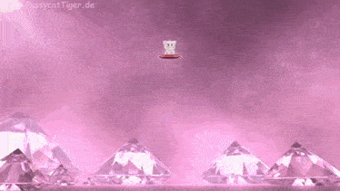 a cat is sitting on a pillow in the middle of a pile of pink diamonds .