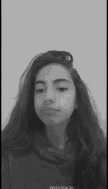 a black and white photo of a girl with a sticker that says " you "