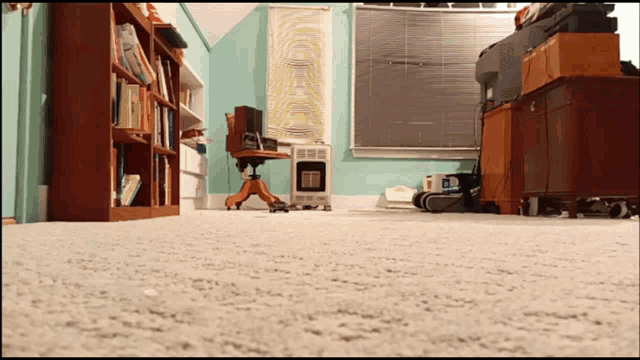 a room with bookshelves and a heater that says ' lg ' on the side