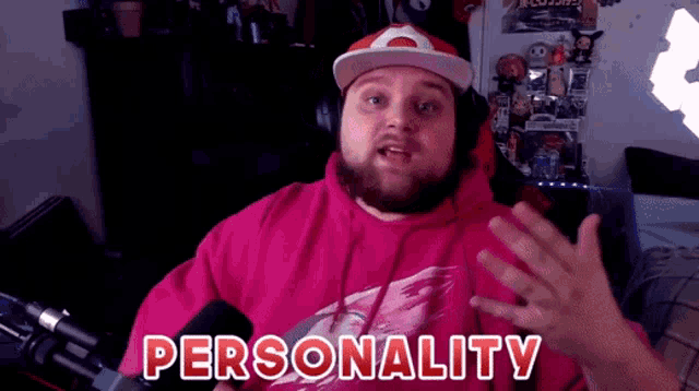 a man wearing a pink hoodie and a hat says personality