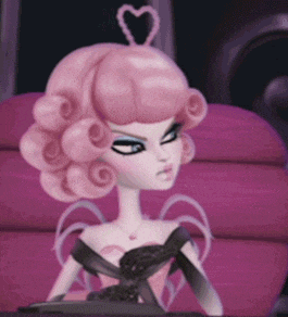 a doll with pink hair and a heart on her head is sitting on a pink couch .