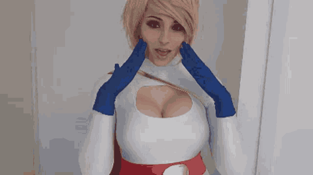 a woman in a superhero costume is making a funny face .
