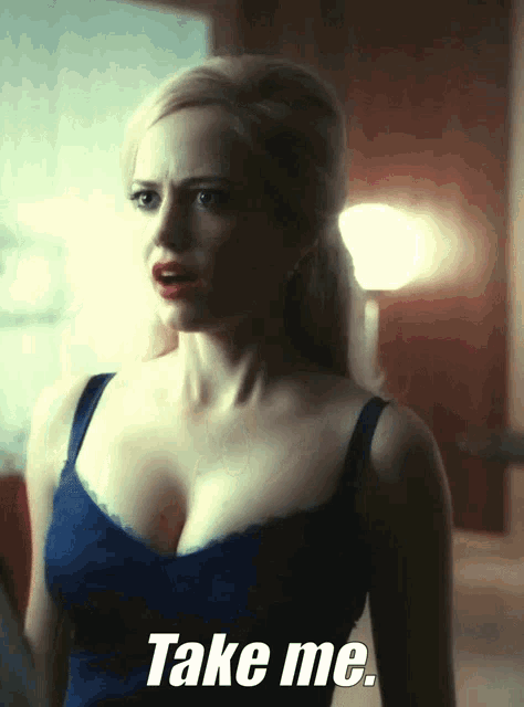 a woman in a blue tank top says " take me "