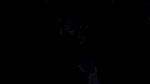 a blurry picture of a person 's back and torso