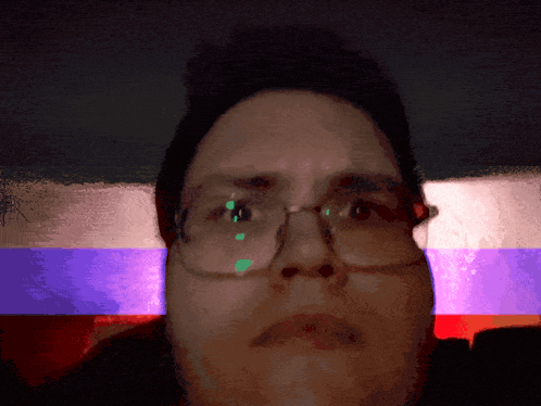 a close up of a person 's face with a flag in the background