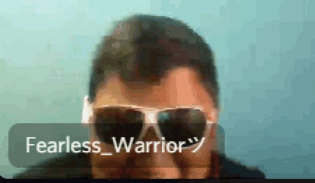 a man wearing sunglasses and a speech bubble that says " fearless warrior "