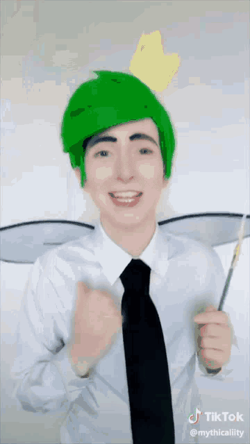 a man with green hair is wearing a white shirt and tie