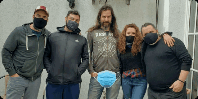 a group of people wearing face masks including one wearing a shirt that says ran
