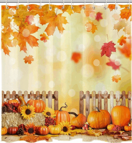 a shower curtain with pumpkins and leaves behind a fence
