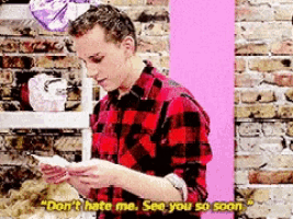 a man in a plaid shirt says " don 't hate me see you so soon " while holding a piece of paper