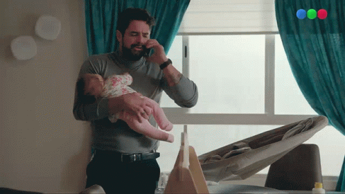 Babysit On The Phone GIF - Babysit On The Phone Taking Care Of Baby GIFs