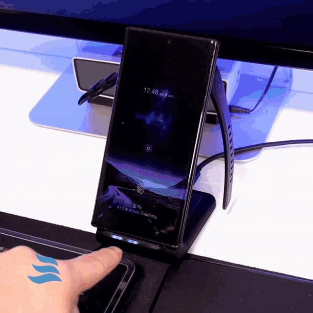a phone that has the time of 17.48
