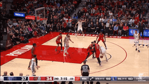 a basketball game is being played on a court that says portland on it