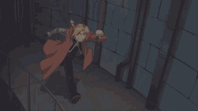 a man in a red jacket is standing on a spiral staircase with his mouth open