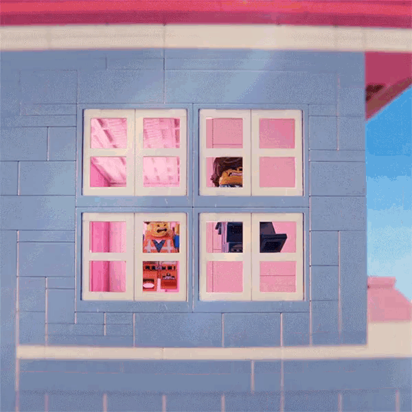 a lego figure is looking out of a window in a pink house