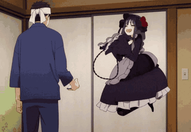 a man with a bandana on his head stands next to a maid